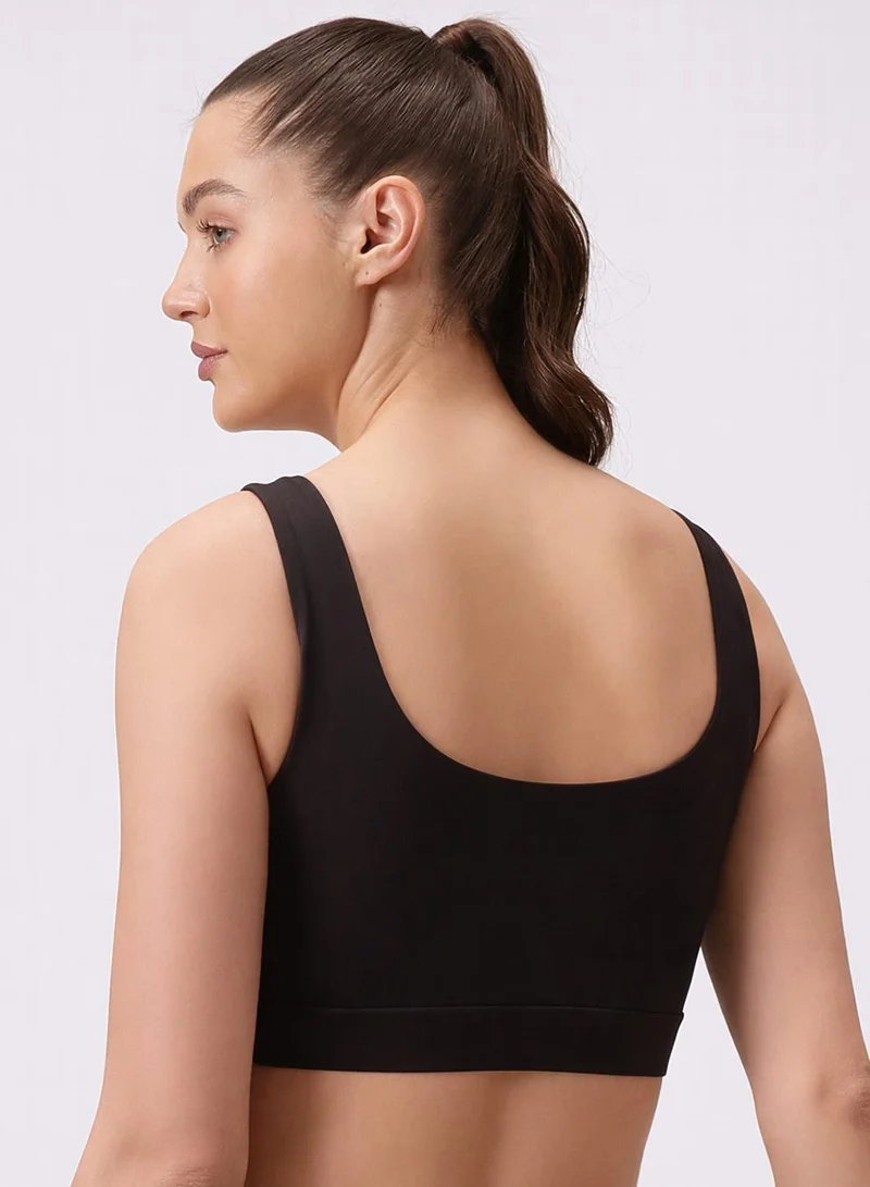 Clovia Black Medium Impact Sports Bra in Black with Removable Cups for Women | Best Price UAE